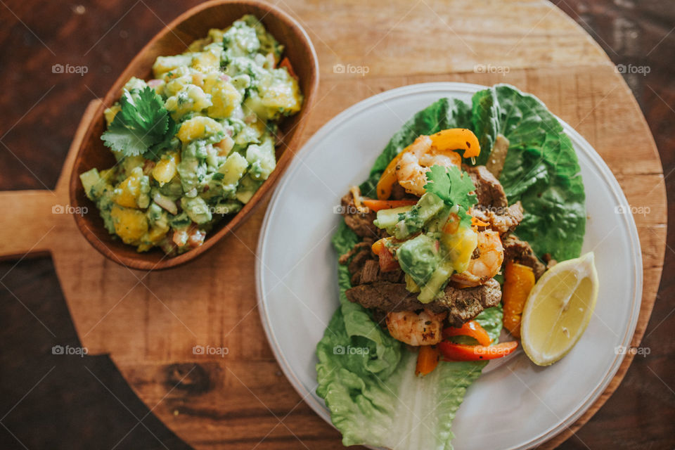 Surf and turf protein style tacos with spicy mango guacamole. Whole 30 paleo friendly recipes.