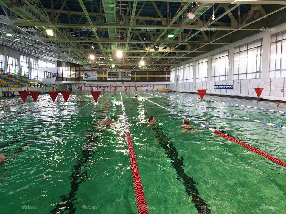 Large swimming pool with water of green color