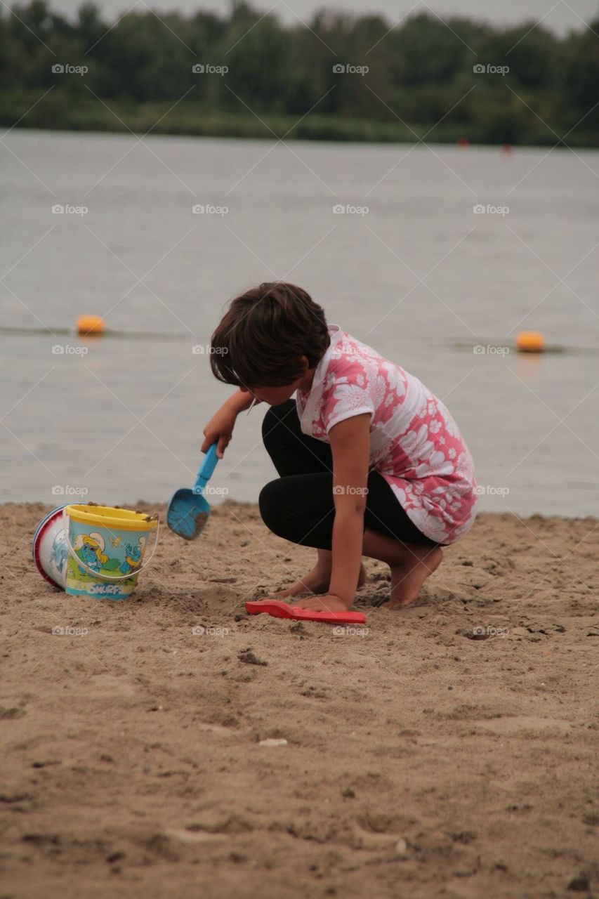 Girl Playing on the Beach