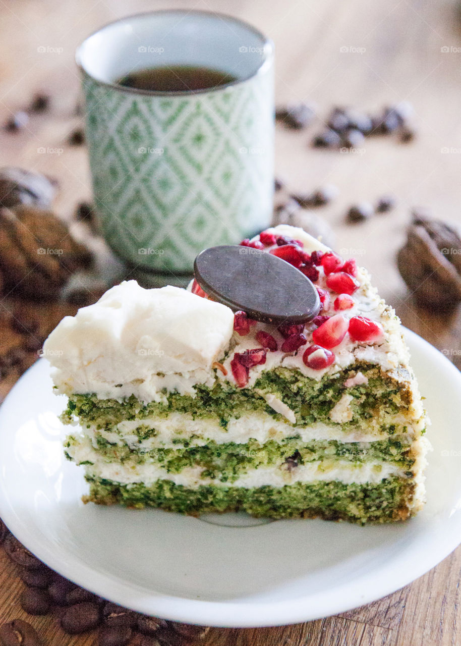 Spinach cake and cup of coffee