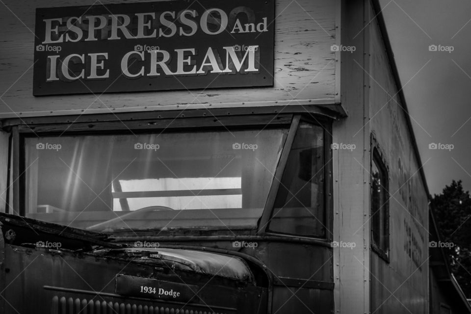 An old Dogge 1934 transformed in a Ice Cream truck. Its age just adds to its vintage mood. A good subject for a black and white photo.