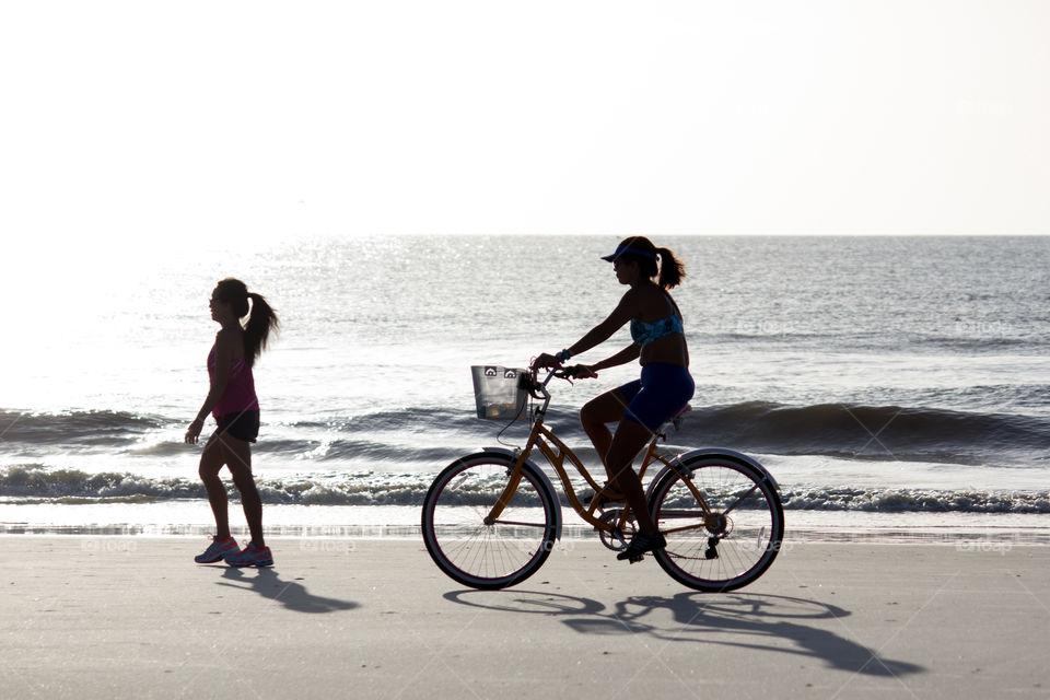 Woman on Bike at Beach