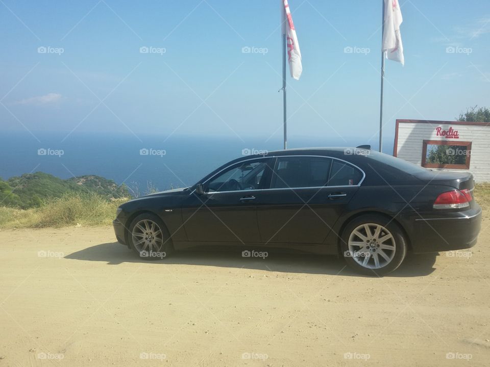 BMW 750Li V8 engine beside sea