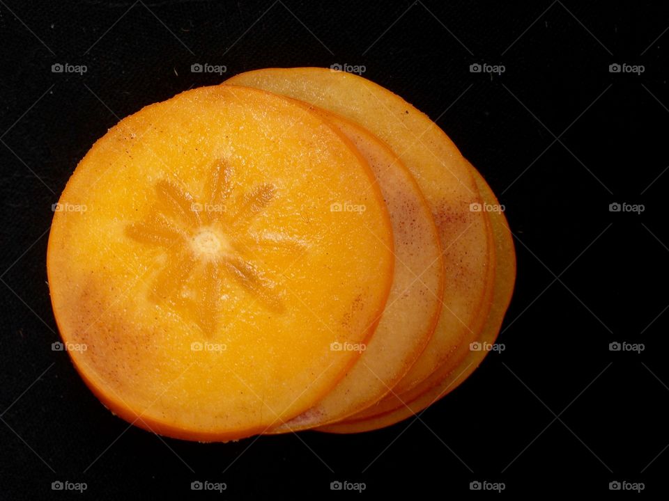 Persimmon sliced from above 