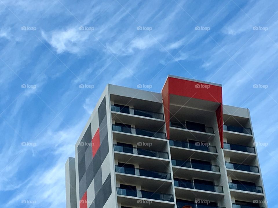 Contemporary building showing red, grey and black abstract design.