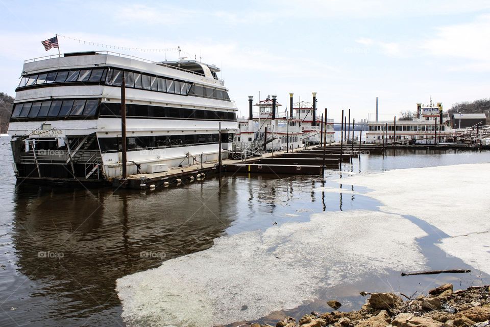 Ships docked on the thawing river 
