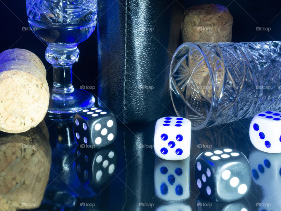 Table gambling with dice in the evening with dim light on a dark background