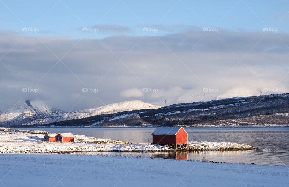 Shelters in winter landscape. 