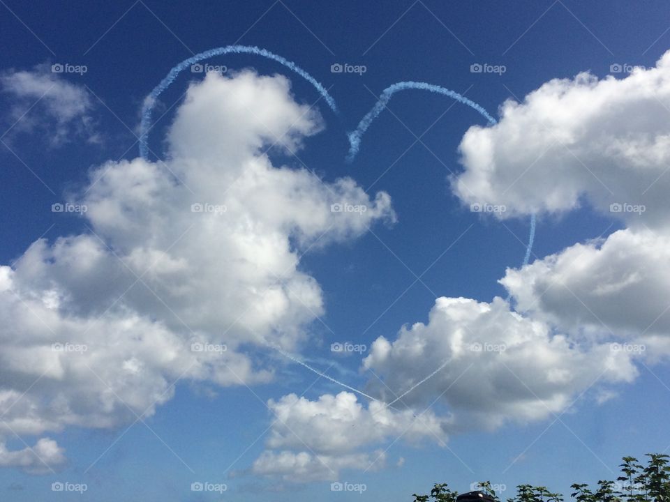Heart made with vapor trail in sky