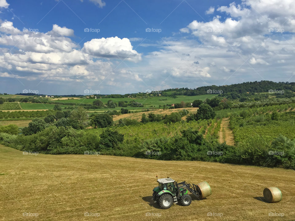 Tractor working in the fields in the countryside