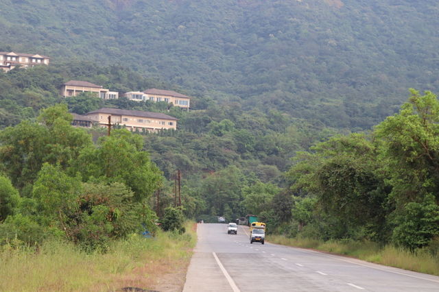 long road and hill town.