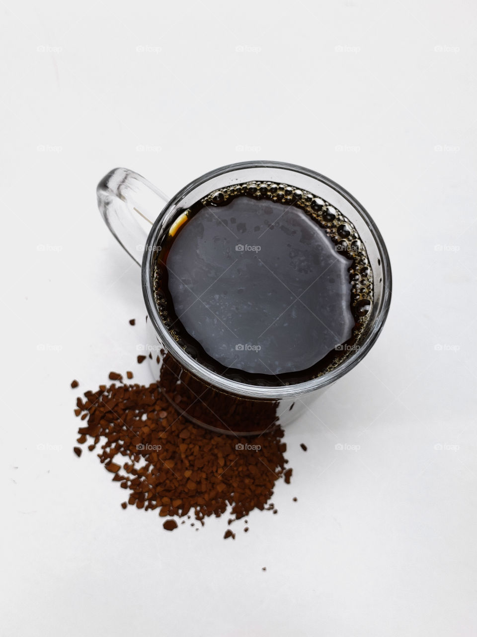 cup of coffee and coffee beans on the white background