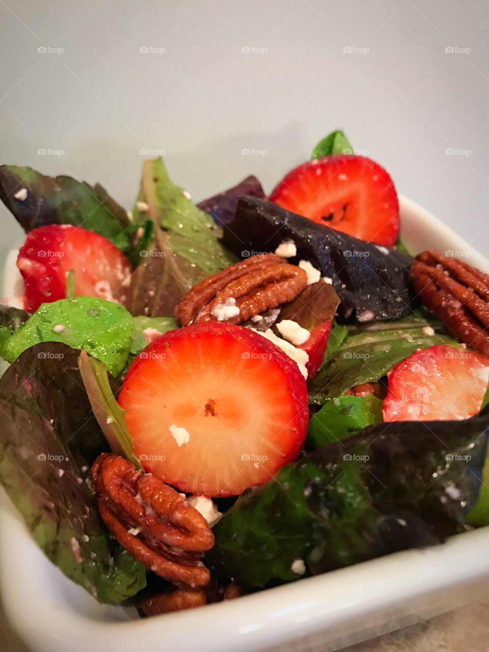 Strawberry spinach salad with pecans and feta cheese 
