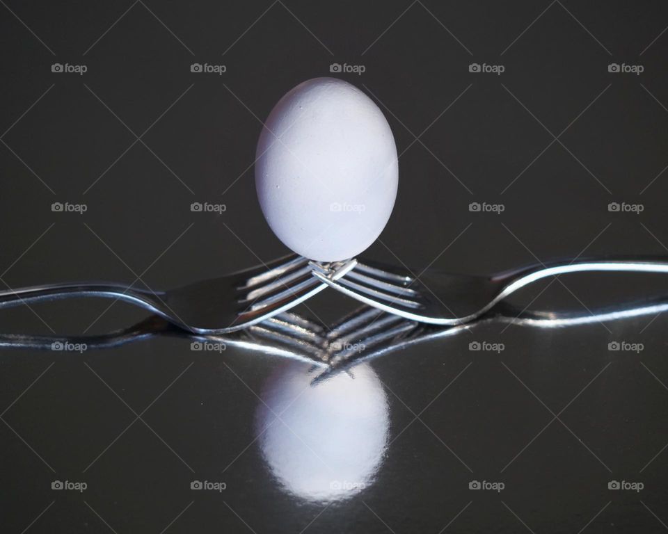 White egg on forks