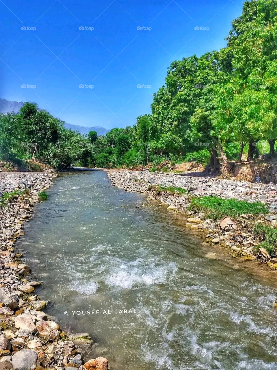 Glory be to God, the magnificent and picturesque view and the natural green trees are a view that is nothing more wonderful than it