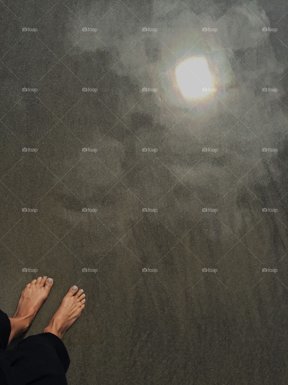 Sun trapped by my feet 