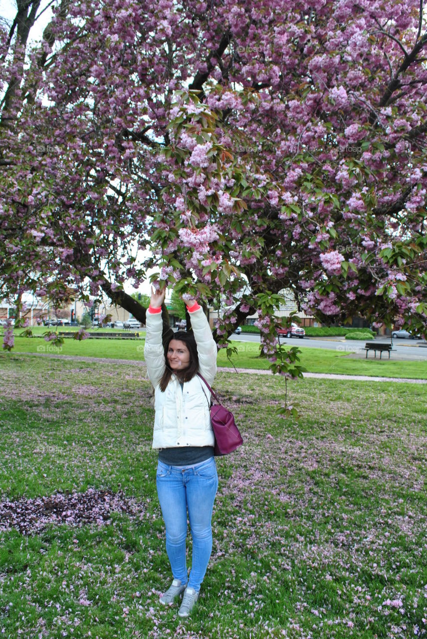 A girl and a blooming tree