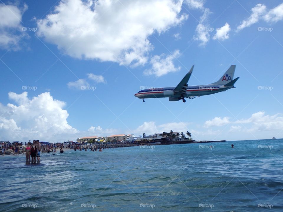 Plane landing over st Martin beach