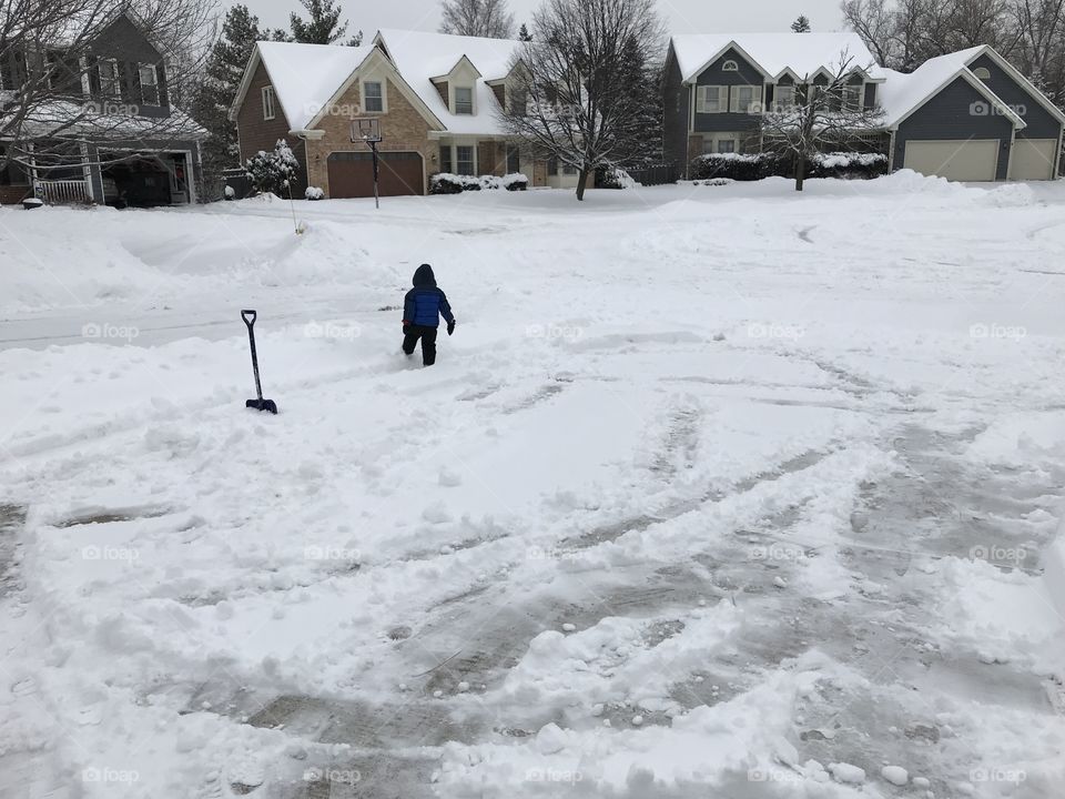 Toddler playing in snow 
