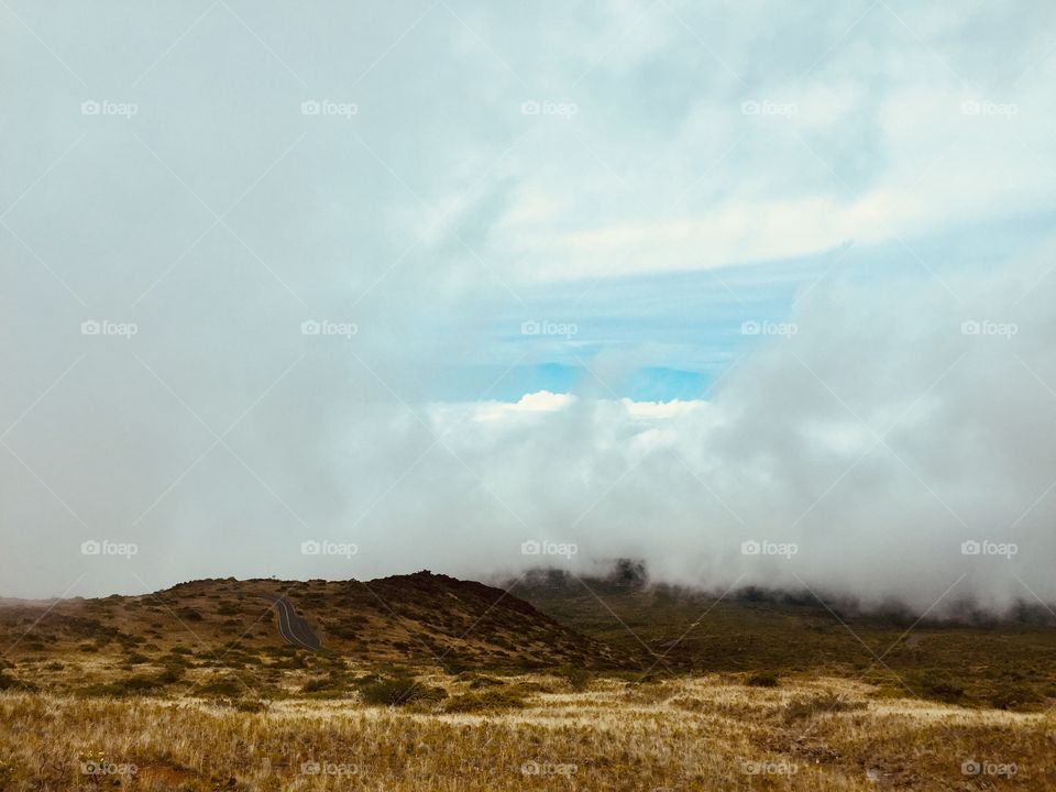 Above clouds top of the volcano 