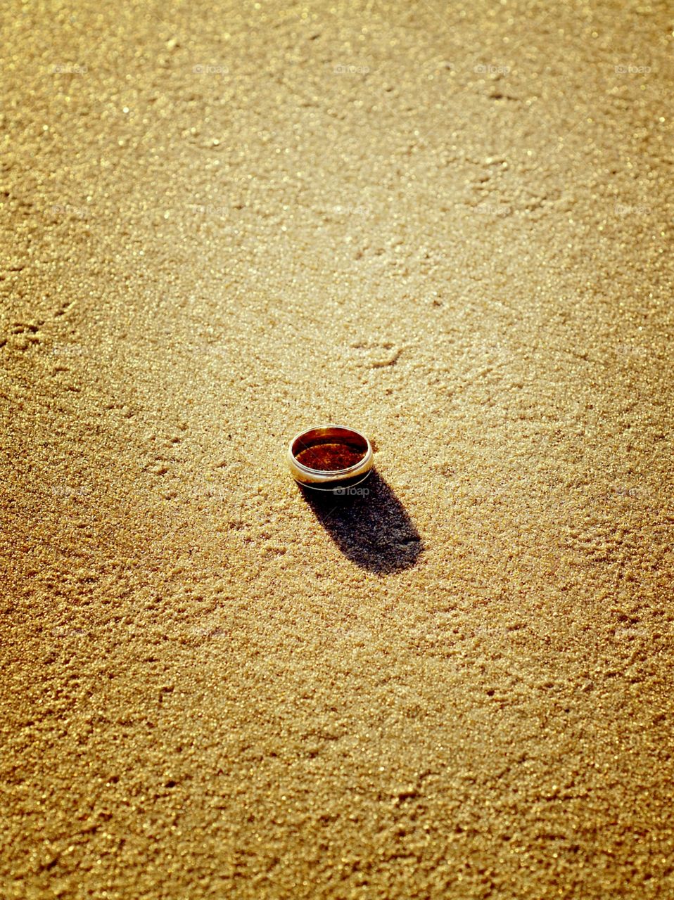 A wedding band in the sand.