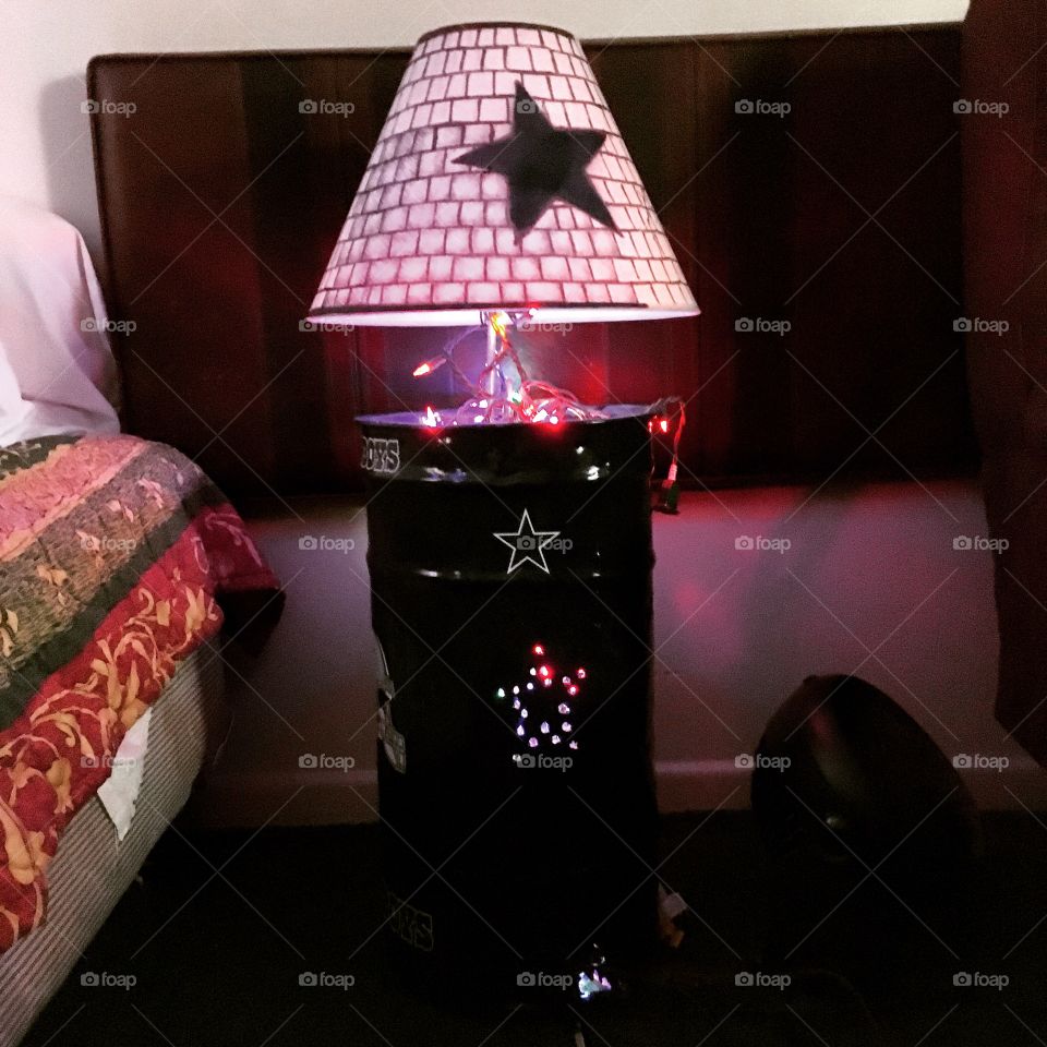 I took an old 30 gallon trash can and made a Dallas Cowboys football lamp 