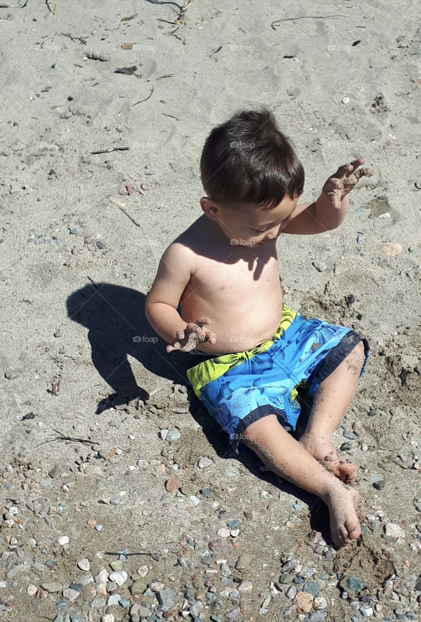 Boy playing in sand