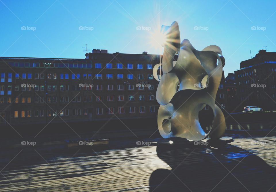 Sunrays on a sculpture