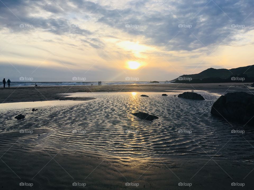 Combesgate beach in north Devon, naturally lit by a summer sunset 