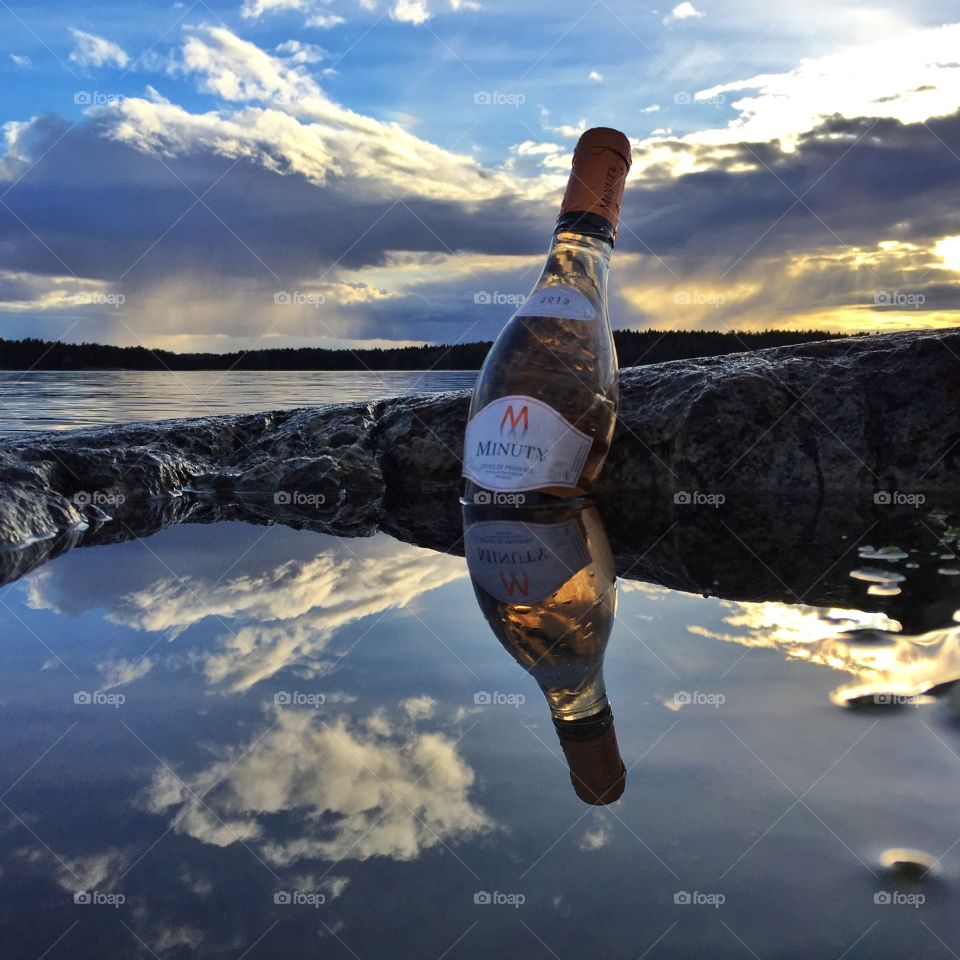 Minuty rosé wine bottle. A bottle of Minuty rosé wine in the sunset, Gryt archipelago, Sweden