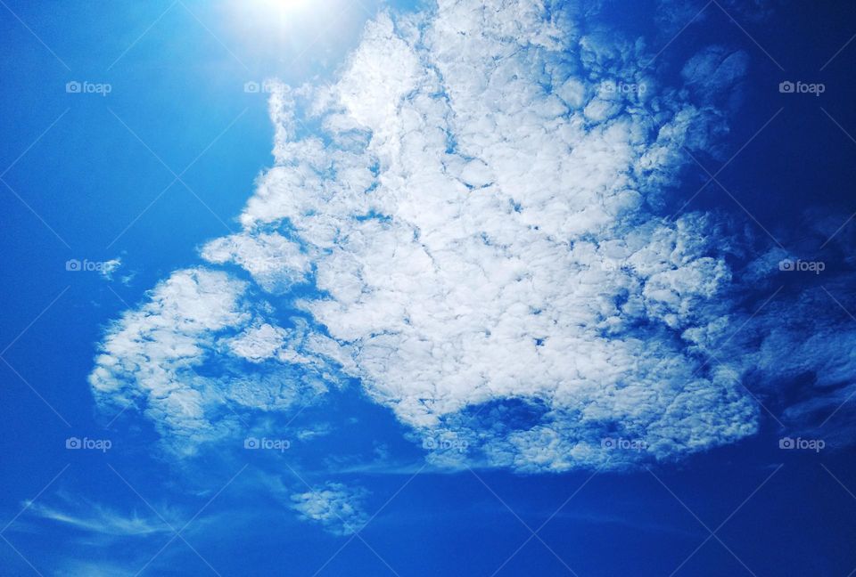 Cloudscape, the beauty of altocumulus clouds and sunlight in a clear sky.