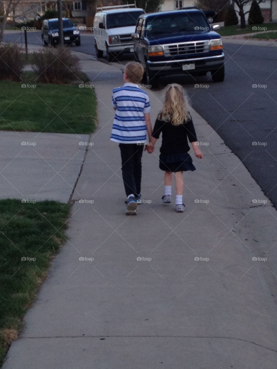 Siblings holding hands 