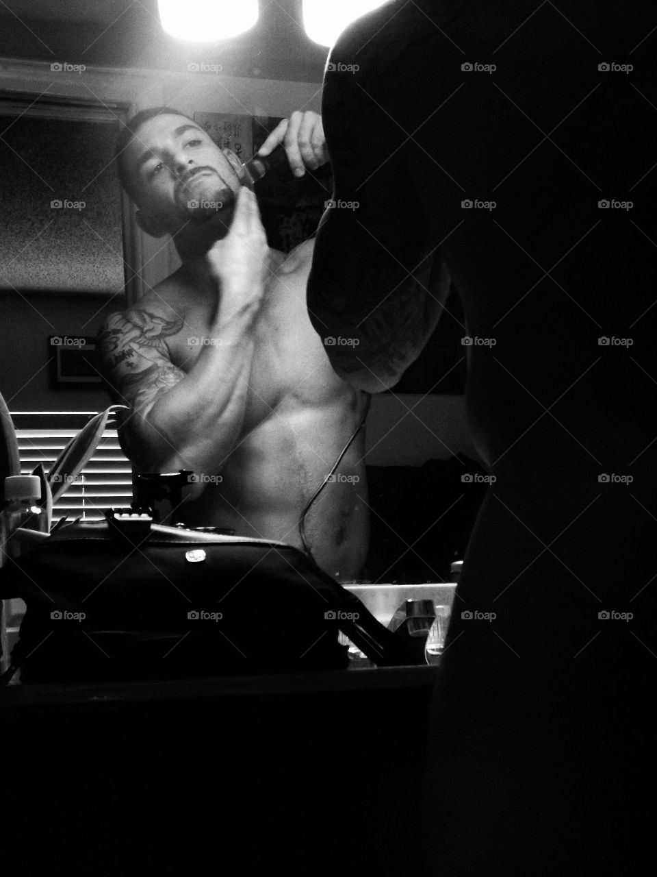 Man using electric razor