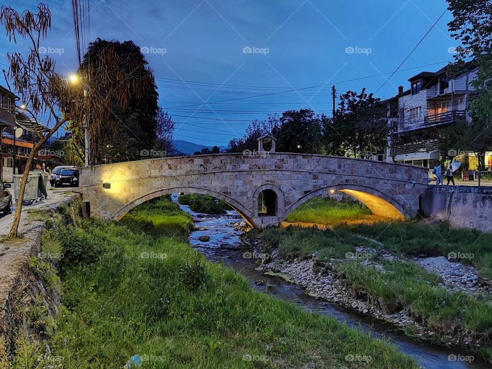 Old city bridge. Old stone bridge. Walking on  an old stone bridge.