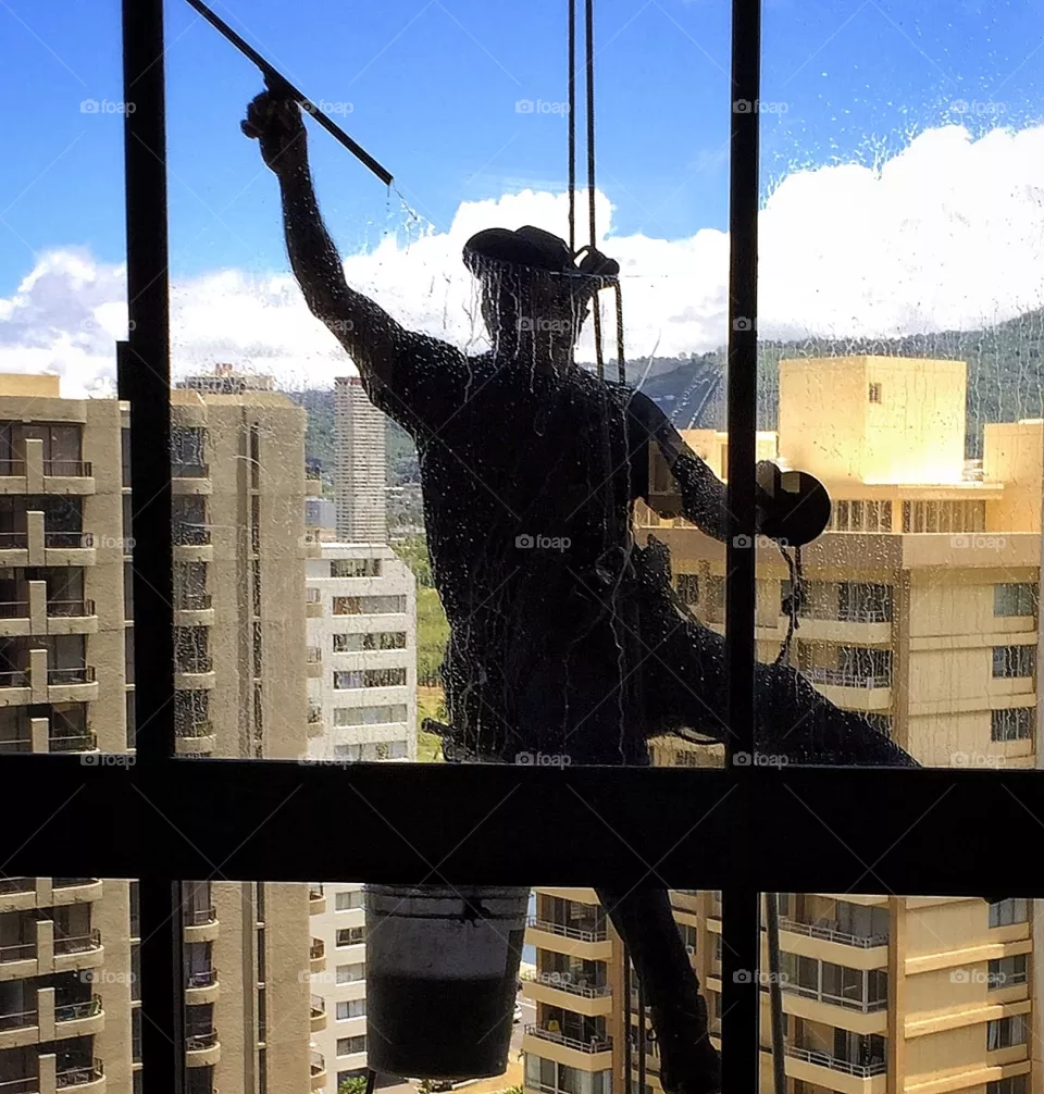Window washer working on high-rise building