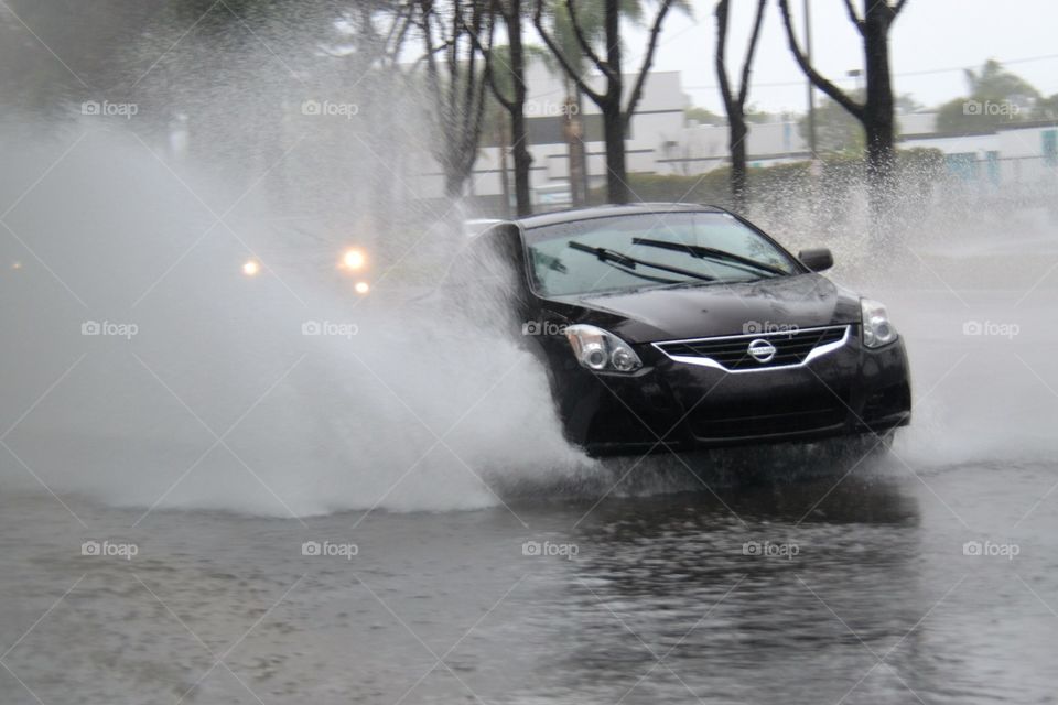 Vehicle going through flooded street in California in winter