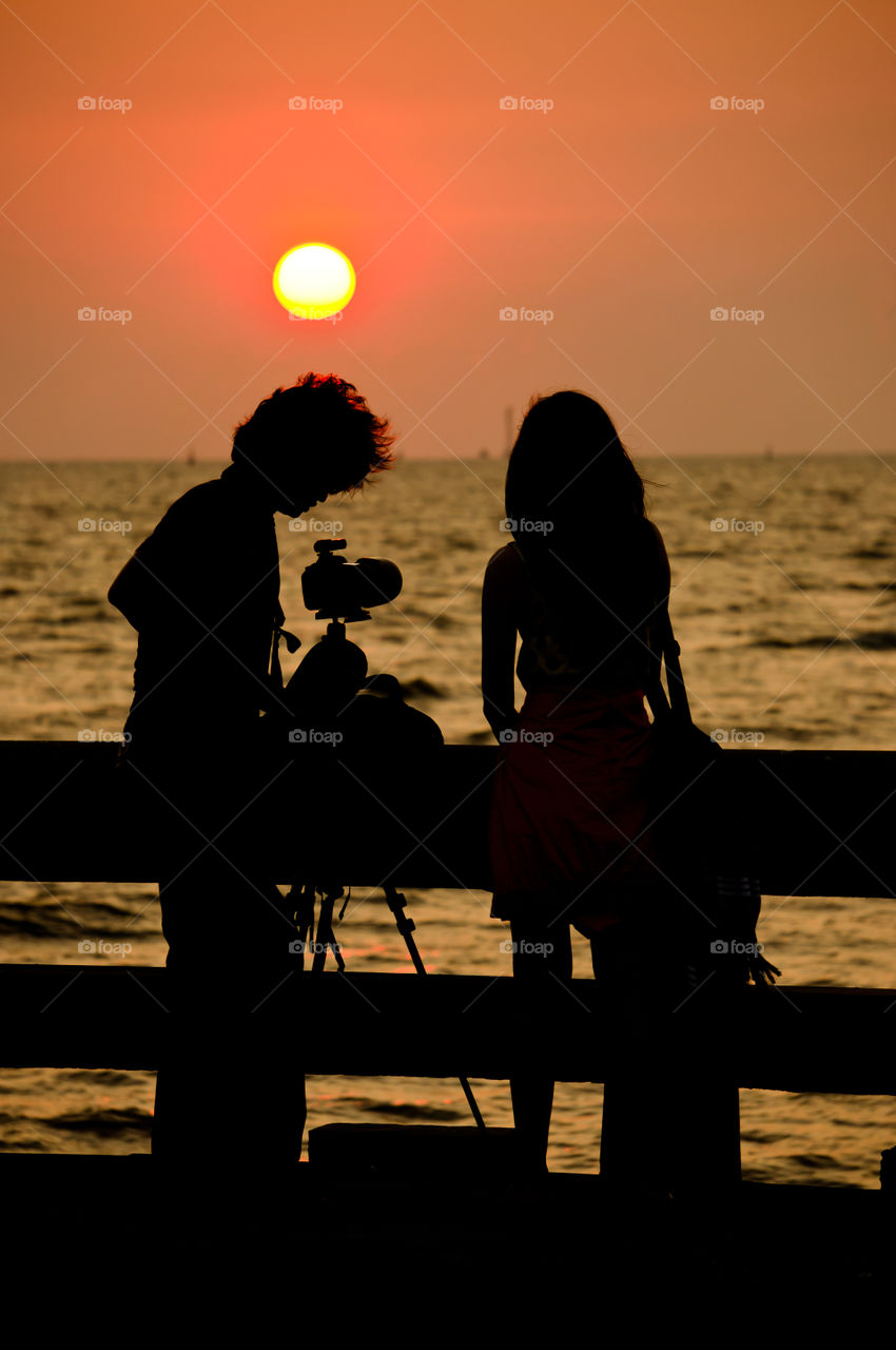 Couple. A couple taking photo during sunset