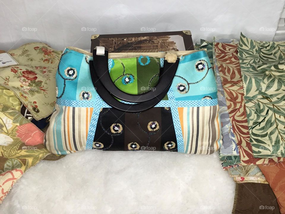 Patchwork Purse is a unique, one of a kind bag, in a gorgeous assortment of prints and solid fabric samples and remnants that create a neutral yet versatile