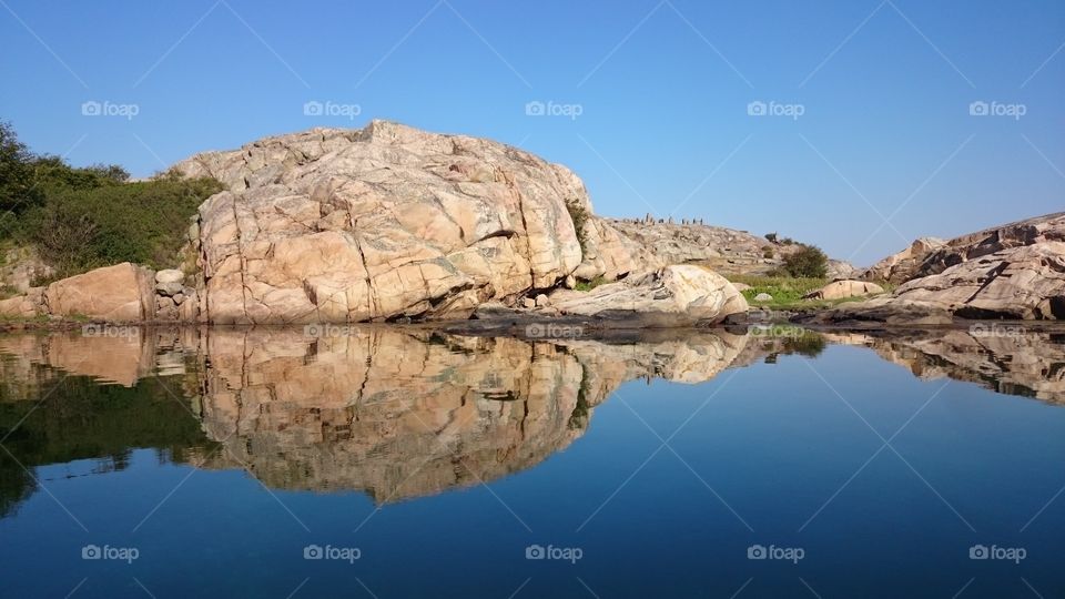 Rocky mountain reflected on idyllic lake