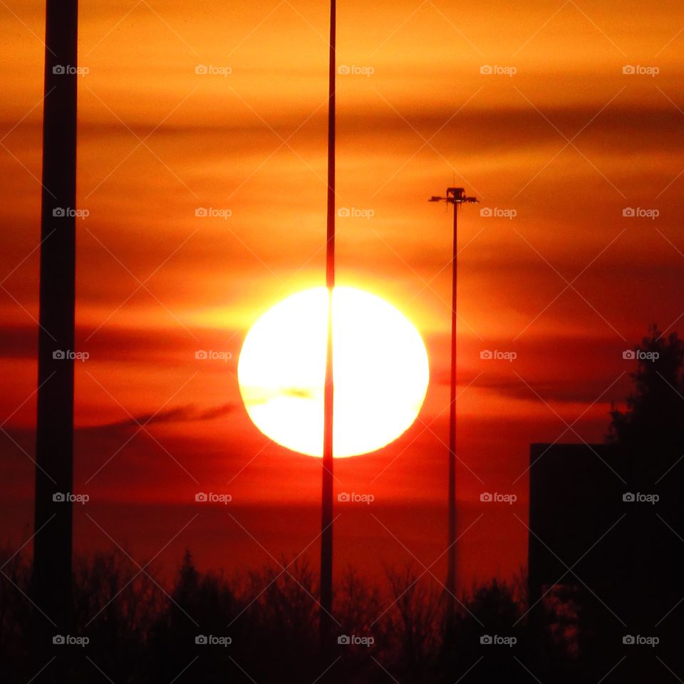 early morning sunrise over the Sacramento international airport. with yellow red and orange clouds in the background