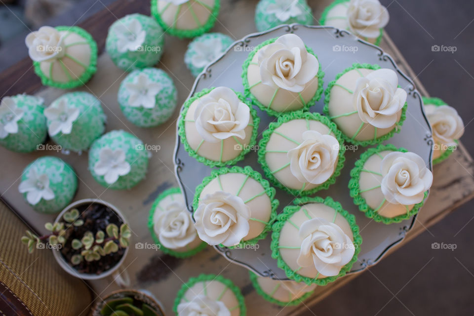 Green cup cakes on wedding . Wedding cupcakes for guests 