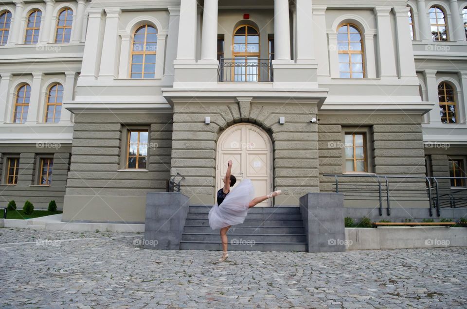 Young Female Ballerina Dancing Outside