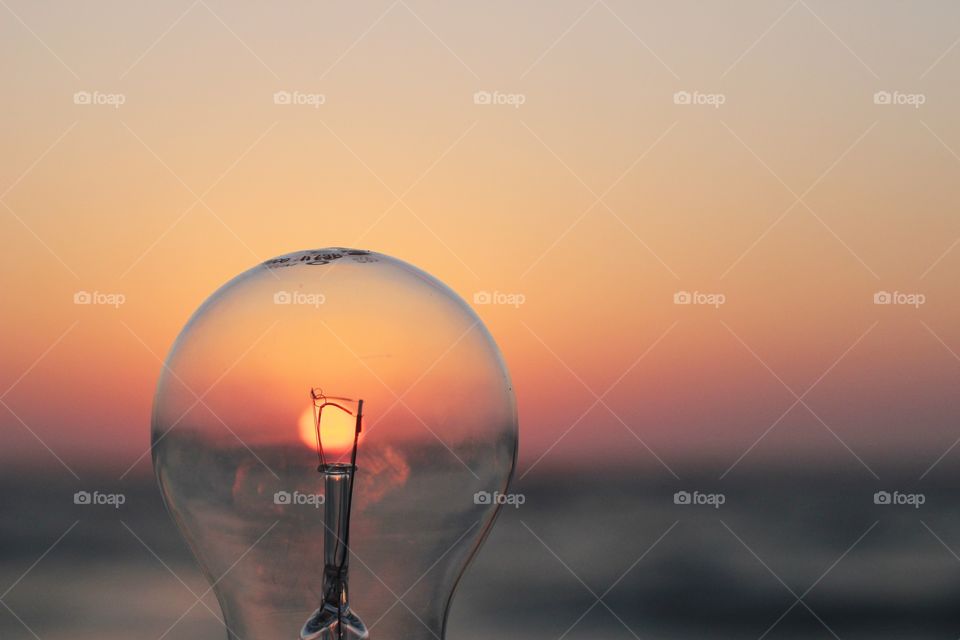 Sunset seen through light bulb