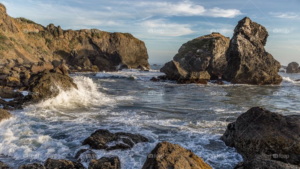 Wave at rocky beach