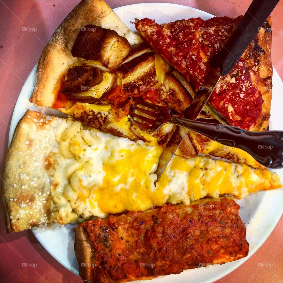 Variety of pizza slices on plate