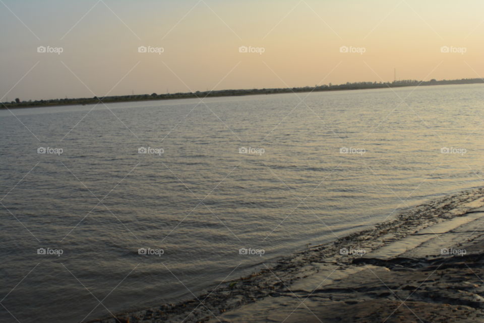 not a sea beach but a river bank. for me, its not less than beach. situated behind my home.. best place to spend evening. sunset at its best. sound of water, fresh air, peaceful atmosphere. perfect place for a nature lover. river narmada in bharuch district of Gujarat state in India.