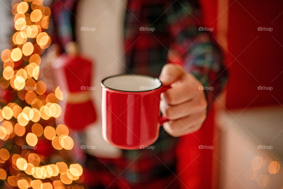 cup of coffee in a cozy festive Christmas atmosphere