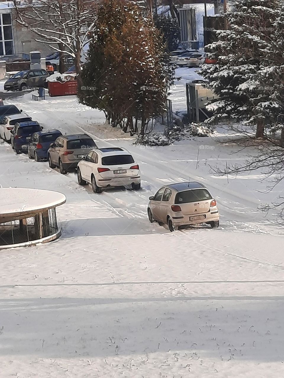 cars parking  in snow