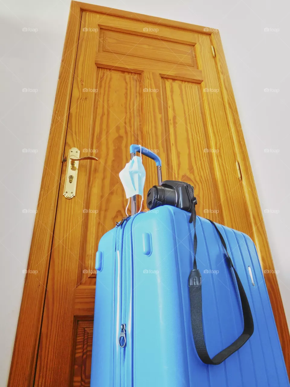 travel suitcase prepared with my camera and my mask ready to enjoy vacations