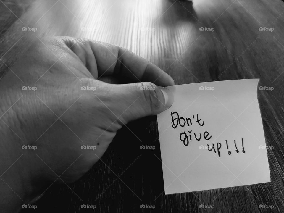 Motivational quotes on a small piece of paper